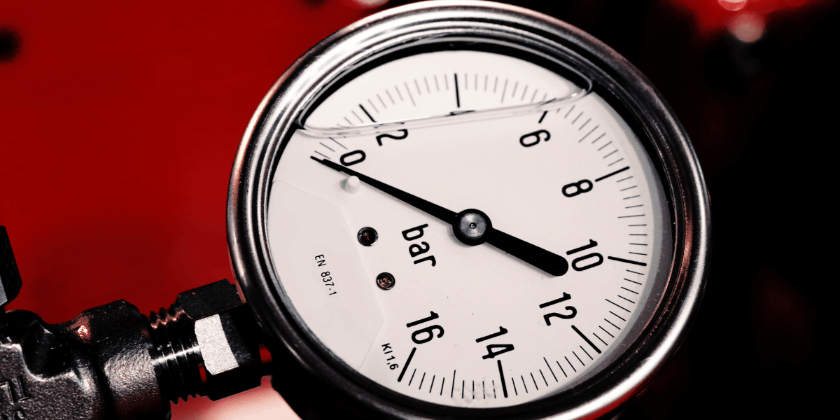 Close-up of a pressure gauge showing bar units.
